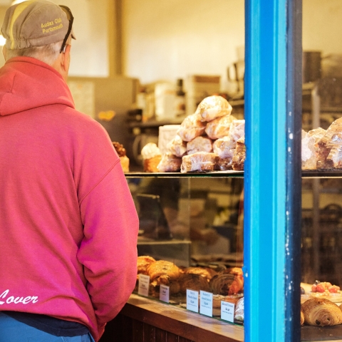 Shopper in Pink Hoodie examining food on display
Bread Addiction - Elm Grove - City Guide 2022