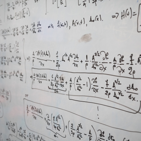 Mathematical equations on a whiteboard