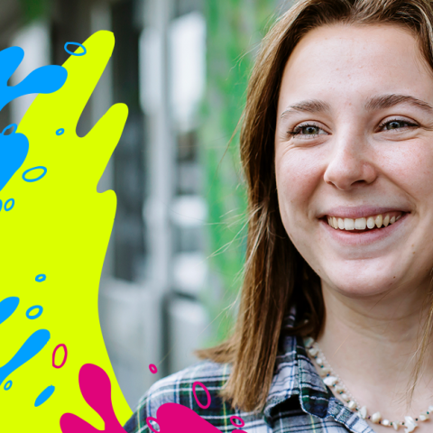 Female student smiling, she has brown hair 