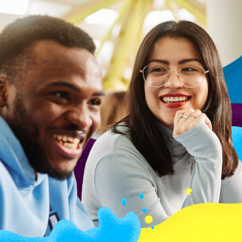 Two students smiling