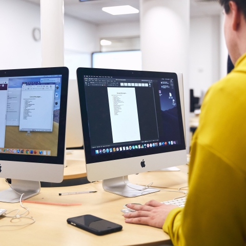 Student behind a computer