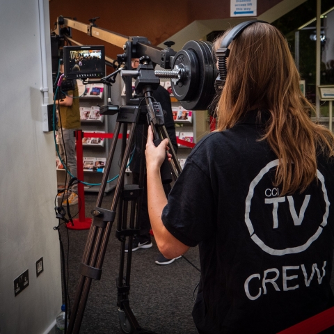 A person using a sound system with condenser microphone
