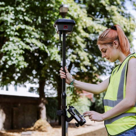 Student uses measurement device outside of Technology Facilities