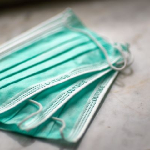 a stack of three face masks