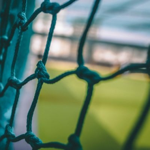 A close up photo of a football goal net