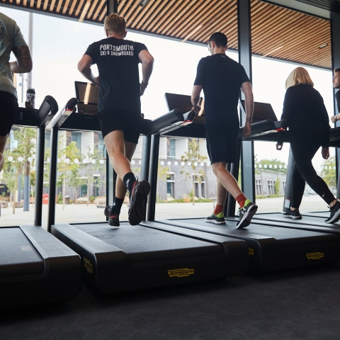Visitors using treadmills in fitness suiteRavelin Internal Photos