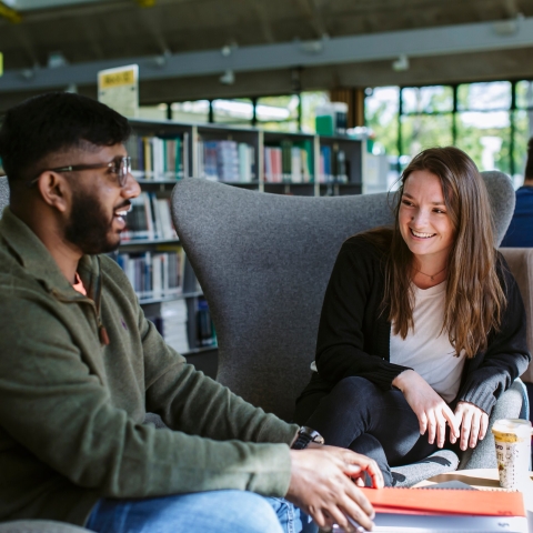 Two students at a seminar desk