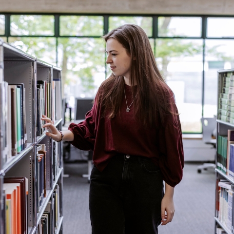 B-roll Day one - selecting and reading book in the library