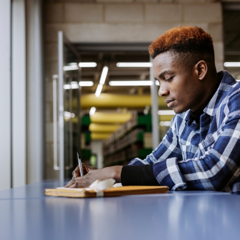 University of Portsmouth student in the library