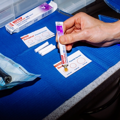 Flouride varnish being applied to a test card