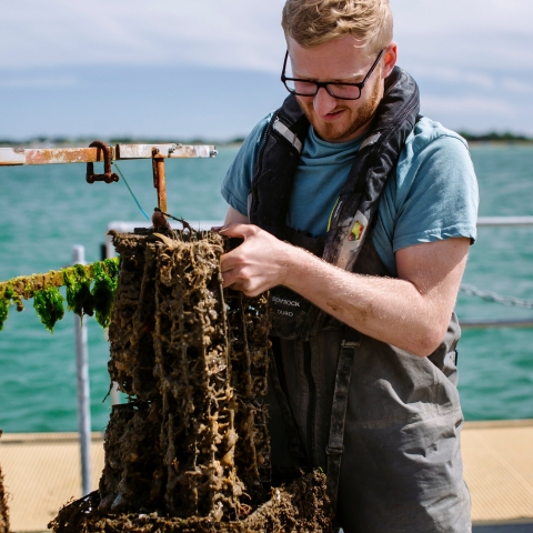 student inront of the sea