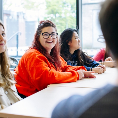 A group of four female students in a tutorial session