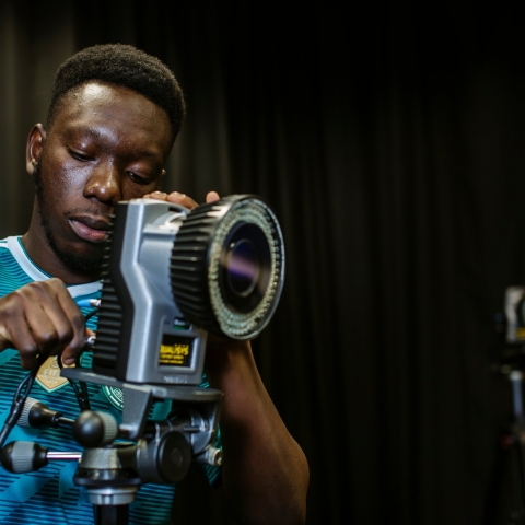 A person using a device with a wide lens