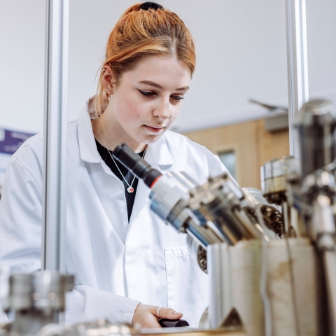 Student conducting observation on device in Technology Facilities