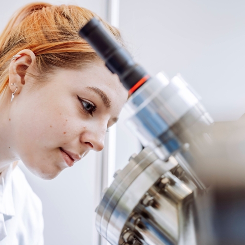 Student conducting observation on device in Technology Facilities