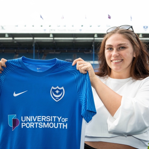 Isibeal O’Carroll holding up PFC shirt