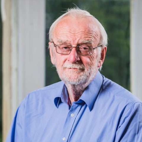 John Craven smiling to camera in headshot