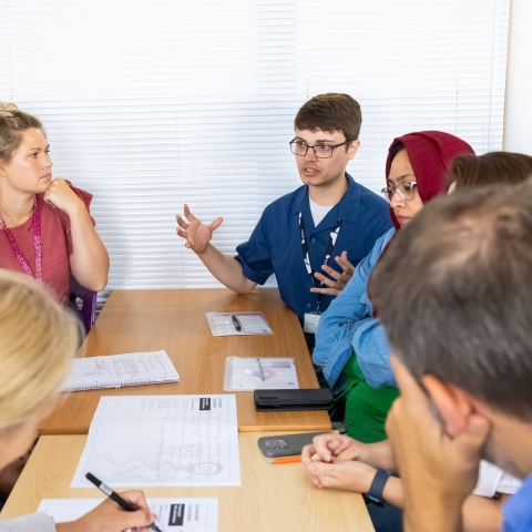A group of people in discussion at the Learning and Teaching Conference 2025