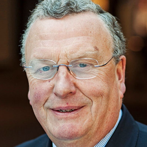 Nairn Wilson smiling to camera in headshot