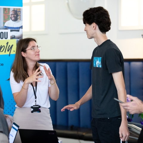 Parents and students talking with staff at the information fair  - Open Day 2023