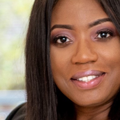 Headshot of Roni Savage smiling to camera