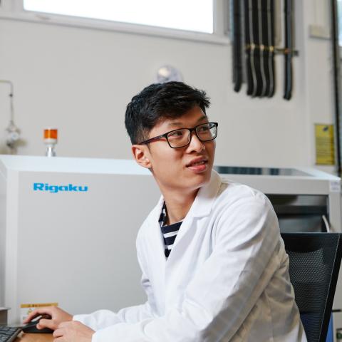 Male University of Portsmouth PhD student in X-Ray Fluorescence laboratory