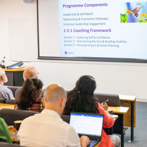 Staff sat listening to a session