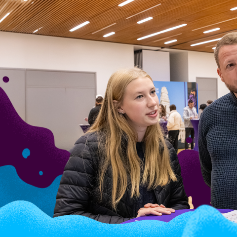 Female applicant with father checking into an Open Day