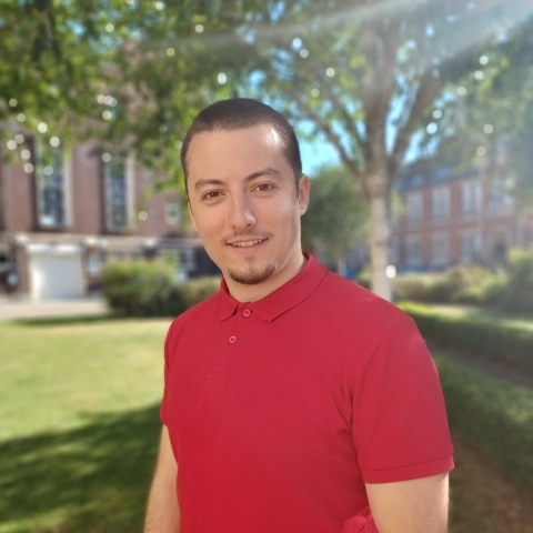Global Recruitment officer Teddy looking at the camera