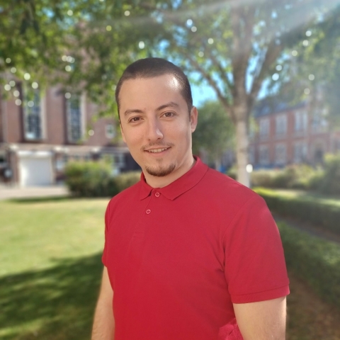 Global Recruitment officer Teddy looking at the camera