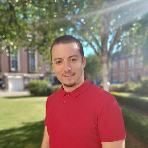 Global Recruitment officer Teddy looking at the camera