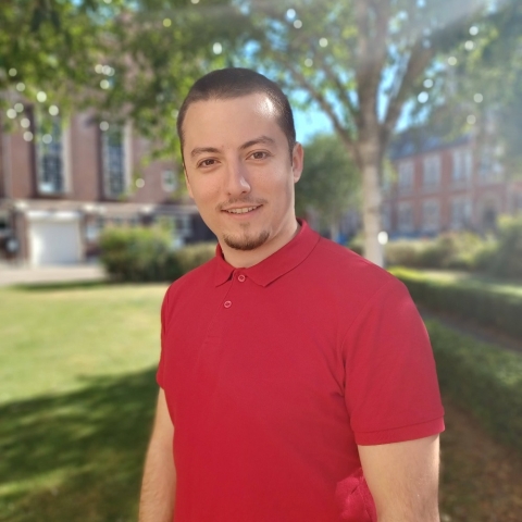 Global Recruitment officer Teddy looking at the camera