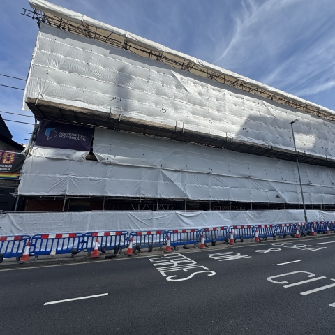 Building surrounded by scaffolding