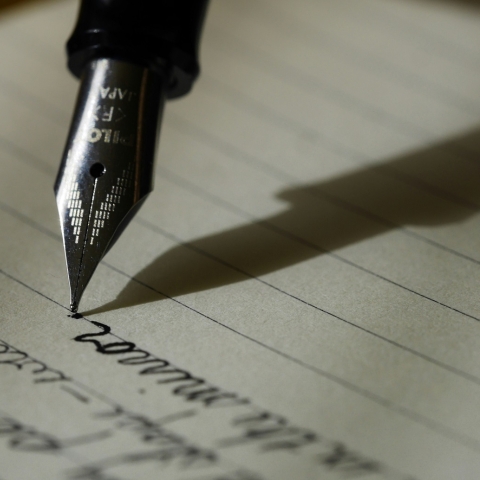 Pen writing on paper