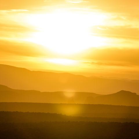 photo of the sun as it sits low in the sky