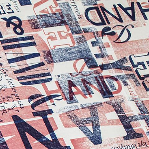 Printed letterpress sample text in blue and red ink