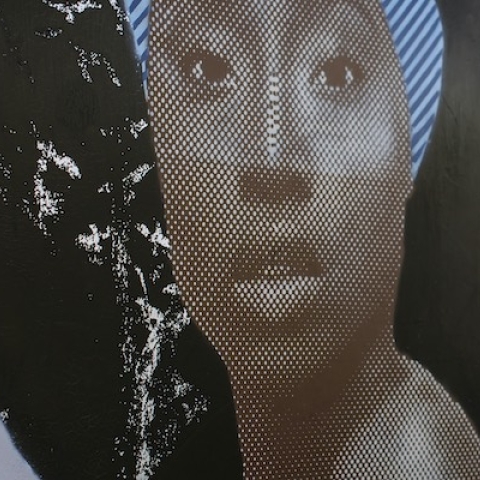 Graffiti of black woman in inner city environment