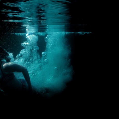 Woman swimming outdoors in Cornwall