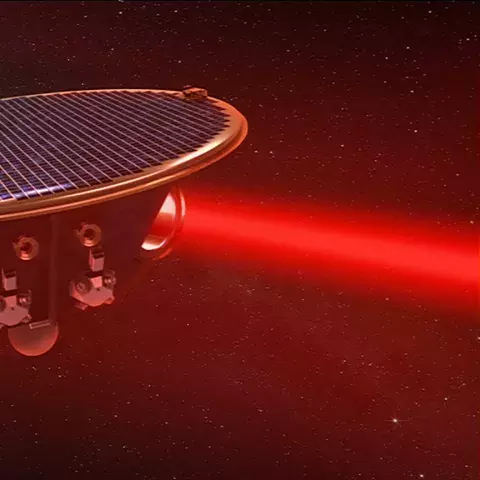 Lasers fired between the satellites, shown in this artist's concept, will measure how gravitational waves alter their relative distances.