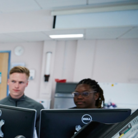 Student wearing a breathing monitoring mask