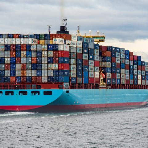 cargo ship loaded with cargo containers on its way