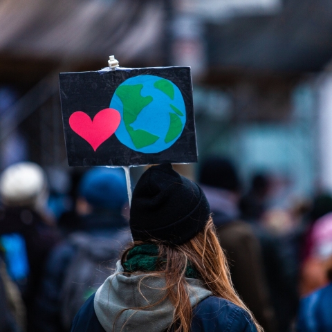 Woman holding sign at environmental march