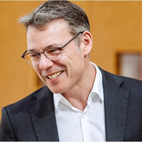 member of staff having a discussion with a student