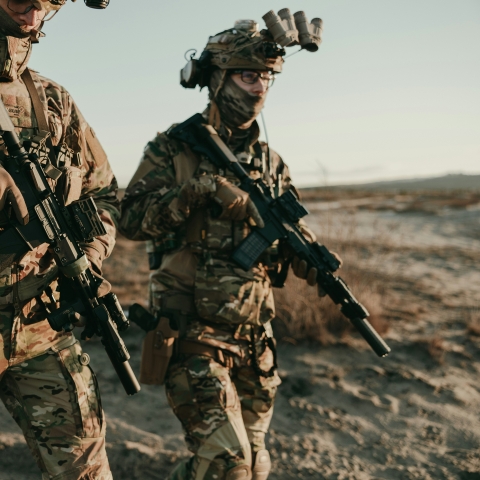 two individuals in military kit