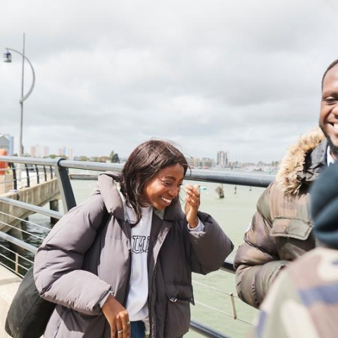 BAME Students laughing at the seaside