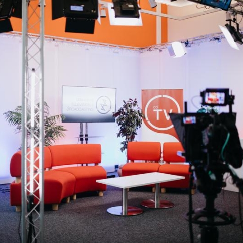 A film set with sofas and screens