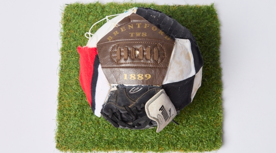 Photoball stitched together with various materials and wording by Matthew Pearce