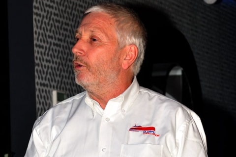 Alan Priddy stood giving a talk wearing a shirt