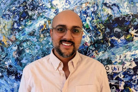 Headshot of graduate Arun Verma smiling to camera