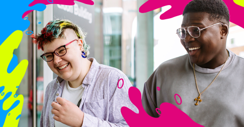 Two students smiling and laughing together